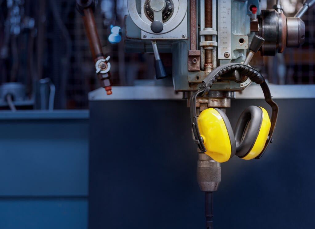 Ear Defenders hanging on an industrial machine